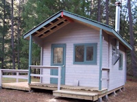 A custom machined log cabin built in California's beautiful Shasta National Park, California by bavariancottages.com